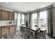 Bright dining area featuring a table with seating, natural light, and kitchen access at 13115 N Departure W Blvd, Camby, IN 46113