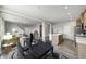 Open-concept dining room and kitchen featuring an island and modern furniture at 13115 N Departure W Blvd, Camby, IN 46113
