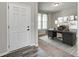 Inviting home office featuring a stylish desk, chair, decor, and lots of natural light from a large window at 13115 N Departure W Blvd, Camby, IN 46113