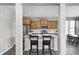 Stylish kitchen with a center island, pendant lighting, and stainless steel appliances at 13115 N Departure W Blvd, Camby, IN 46113