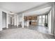 Open-concept floor plan featuring a kitchen with wood cabinets, stainless steel appliances, and a large island at 13115 N Departure W Blvd, Camby, IN 46113