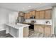 Modern kitchen boasts stainless appliances, marble countertops, and stylish wood cabinets at 13115 N Departure W Blvd, Camby, IN 46113
