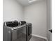 Laundry room with gray finish washer and dryer units at 13115 N Departure W Blvd, Camby, IN 46113