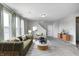 Bright living room with contemporary furniture, natural light and carpet flooring at 13115 N Departure W Blvd, Camby, IN 46113