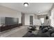Open living room featuring modern decor and a cozy seating area with carpet and large windows at 13115 N Departure W Blvd, Camby, IN 46113