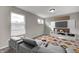 Cozy living room with a modern entertainment center, comfortable seating, and bright windows at 13115 N Departure W Blvd, Camby, IN 46113