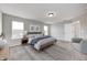 Comfortable primary bedroom features ample natural light, neutral walls, and a well-lit bathroom at 13115 N Departure W Blvd, Camby, IN 46113