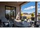 Comfortable covered back porch with inviting seating and scenic views of the surrounding area at 16392 Grand Cypress Dr, Noblesville, IN 46060