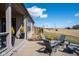 Outdoor patio features a seating area with well-maintained landscaping and views of the golf course at 16392 Grand Cypress Dr, Noblesville, IN 46060