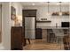 View of the bar area with beverage refrigerator, countertop, and unique seating at 16392 Grand Cypress Dr, Noblesville, IN 46060