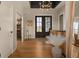 Elegant foyer featuring hardwood floors, a dark ceiling, and a grand entrance with double doors leading to the outside at 16392 Grand Cypress Dr, Noblesville, IN 46060