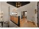 Grand foyer with beautiful hardwood floors, a dark ceiling, and views into the living room and staircase at 16392 Grand Cypress Dr, Noblesville, IN 46060
