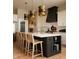 Gourmet kitchen featuring a large island with seating, modern appliances, and custom lighting at 16392 Grand Cypress Dr, Noblesville, IN 46060