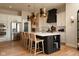 Gourmet kitchen featuring a large island with seating, modern appliances, and custom lighting at 16392 Grand Cypress Dr, Noblesville, IN 46060