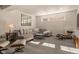Cozy living room features a plush sectional, stylish chairs, and plenty of natural light at 16392 Grand Cypress Dr, Noblesville, IN 46060