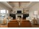 Charming living room with a modern fireplace, dual sofas, and natural light at 16392 Grand Cypress Dr, Noblesville, IN 46060