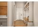 Inviting mudroom with a wooden bench, baskets, and white trim accents at 16392 Grand Cypress Dr, Noblesville, IN 46060