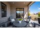 Inviting covered patio with comfortable seating and view of the backyard at 16392 Grand Cypress Dr, Noblesville, IN 46060