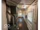 Angle of the basement utility area showing the equipment; small window for natural light at 1925 N Leland Ave, Indianapolis, IN 46218