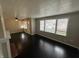 Bright living room with dark hardwood flooring, a fireplace, and lots of natural light at 1925 N Leland Ave, Indianapolis, IN 46218