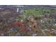 Aerial view of a property and neighborhood featuring nearby golf course and water feature at 208 Northshore Blvd, Anderson, IN 46011