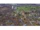 Aerial view of a property and neighborhood featuring nearby golf course and water feature at 208 Northshore Blvd, Anderson, IN 46011
