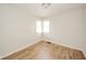 Bright bedroom with corner windows that provide natural light, and hardwood flooring at 208 Northshore Blvd, Anderson, IN 46011