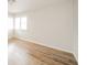 Well-lit bedroom features wood floors, ample natural light from bright, large windows at 208 Northshore Blvd, Anderson, IN 46011