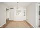 Bright dining room with wood floors, chandelier, and built-in shelving at 208 Northshore Blvd, Anderson, IN 46011
