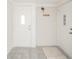 Bright and airy entryway with durable tiled floor at 208 Northshore Blvd, Anderson, IN 46011