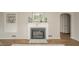 Living area fireplace with decorative mantle, flanking shelves and beautiful hardwood floors at 208 Northshore Blvd, Anderson, IN 46011