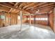 Spacious garage with exposed framing at 208 Northshore Blvd, Anderson, IN 46011