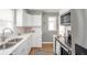 Bright kitchen with stainless steel appliances, ample counter space, and modern finishes at 208 Northshore Blvd, Anderson, IN 46011