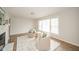 Inviting living room with fireplace, wood floors, and ample natural light at 208 Northshore Blvd, Anderson, IN 46011