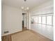 Open living room featuring a decorative light fixture, hardwood and tile flooring at 208 Northshore Blvd, Anderson, IN 46011