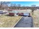 An aerial view captures a charming brick ranch with an expansive yard at 2351 N Raceway Rd, Indianapolis, IN 46234