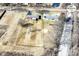 Aerial view of a property with a large yard near a recreational trail at 2351 N Raceway Rd, Indianapolis, IN 46234