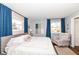 Bright bedroom with hardwood floors, large windows, and neutral decor at 2351 N Raceway Rd, Indianapolis, IN 46234