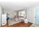 Cozy living room featuring plush seating, a patterned rug, and a well-lit ambiance at 2351 N Raceway Rd, Indianapolis, IN 46234