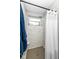 Tiled shower area with a window and modern fixtures at 2351 N Raceway Rd, Indianapolis, IN 46234