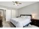 Spacious bedroom features carpet, a ceiling fan, a comfortable bed, and neutral walls at 3145 N New Jersey St, Indianapolis, IN 46205