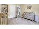 Lovely Bedroom featuring a built-in shelf, changing table and a white rug at 3145 N New Jersey St, Indianapolis, IN 46205