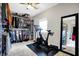 Bedroom featuring walk-in closet with bike, mirror, carpet, and neutral walls at 3145 N New Jersey St, Indianapolis, IN 46205