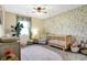 Cozy Bedroom with soft floral wallpaper, a wooden crib, and a comfortable armchair at 3145 N New Jersey St, Indianapolis, IN 46205
