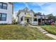 Two-story home with inviting front porch and lush green lawn on a bright day at 3145 N New Jersey St, Indianapolis, IN 46205