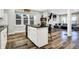 Contemporary kitchen with a black countertop island, stainless steel appliances, and hardwood flooring at 3145 N New Jersey St, Indianapolis, IN 46205