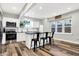 Modern kitchen with stainless steel appliances, white cabinetry, and a stylish island with seating at 3145 N New Jersey St, Indianapolis, IN 46205