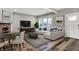 Inviting living room showcasing a brick fireplace, hardwood floors, and ample natural light at 3145 N New Jersey St, Indianapolis, IN 46205