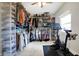 Well-organized walk-in closet with custom shelving, racks, and dedicated space for a Peloton exercise bike at 3145 N New Jersey St, Indianapolis, IN 46205