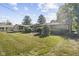 The property features a well-maintained backyard with mature trees and lush landscaping, enhancing privacy at 44 Kessler Blvd W Dr, Indianapolis, IN 46208